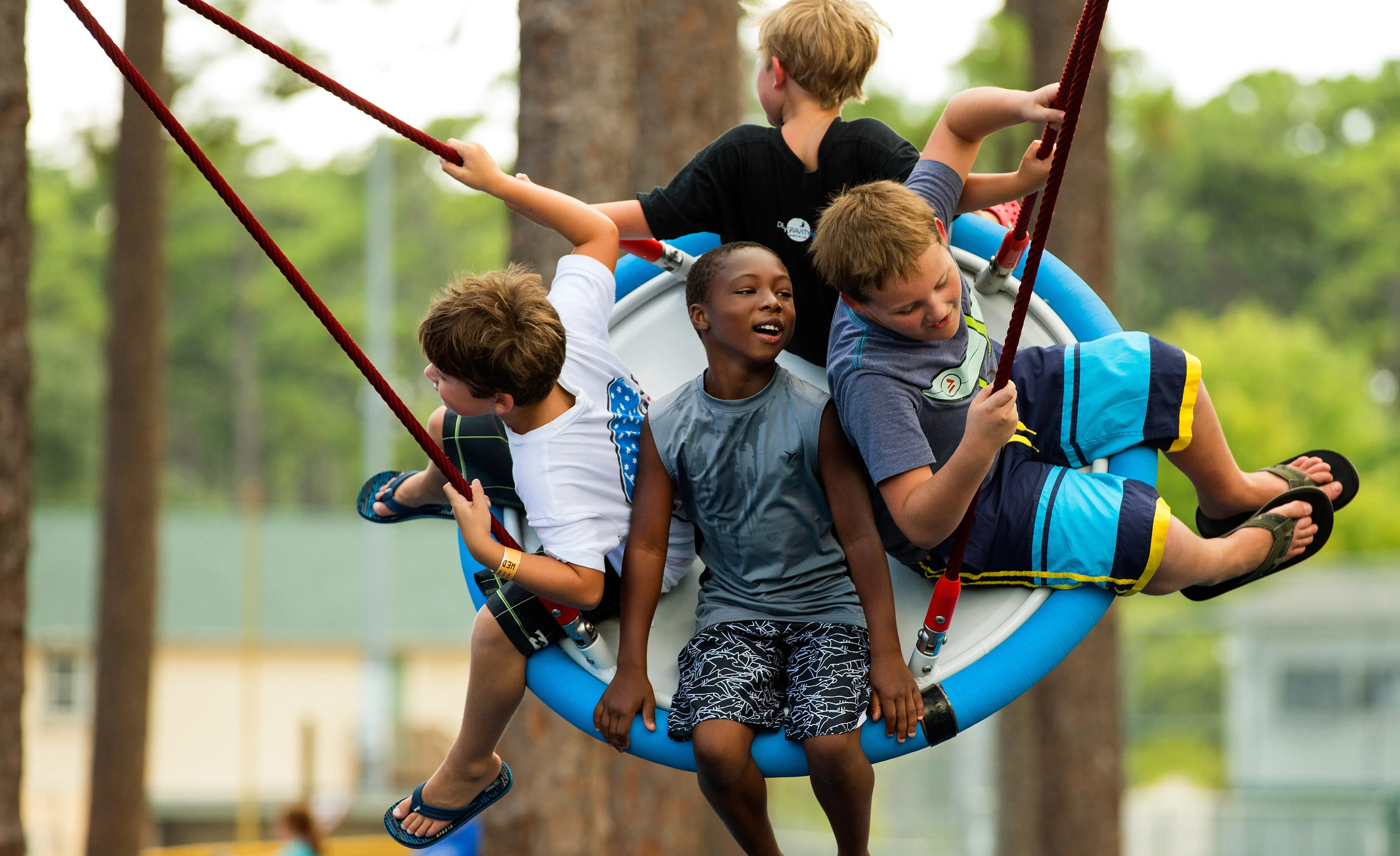 A group of boys playing together, separated from a group of girls.