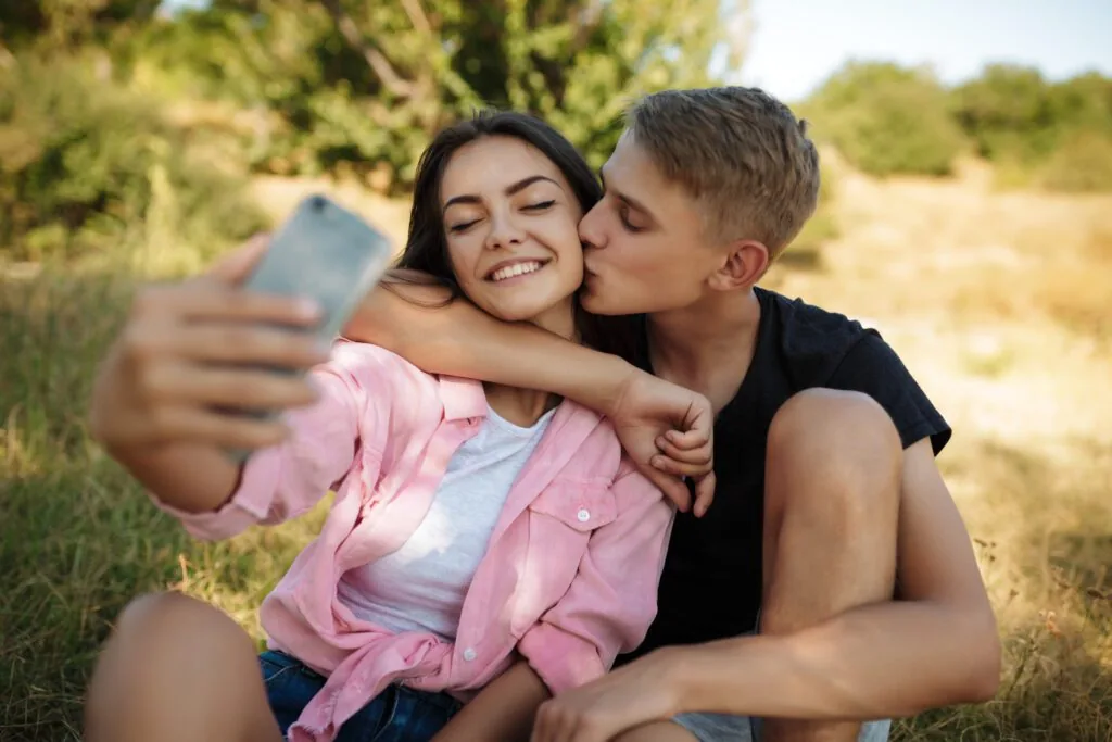 Two teenagers in an early romantic relationship.
