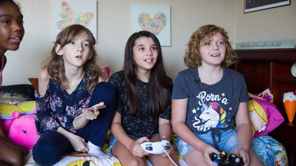 A gender-nonconforming child expressing their identity through dress and play.