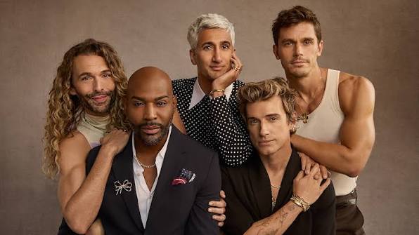 The cast of a makeover-style television show, an example of media that portrays gay men as stylish and affluent.