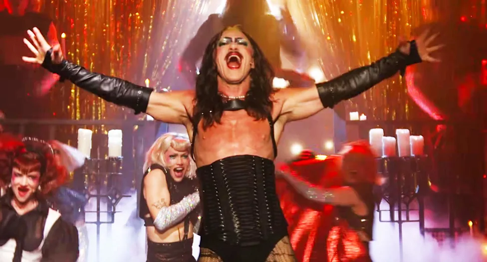 A scene evoking The Rocky Horror Picture Show, whose 'sweet transvestite' character normalized cross-dressing for many viewers.