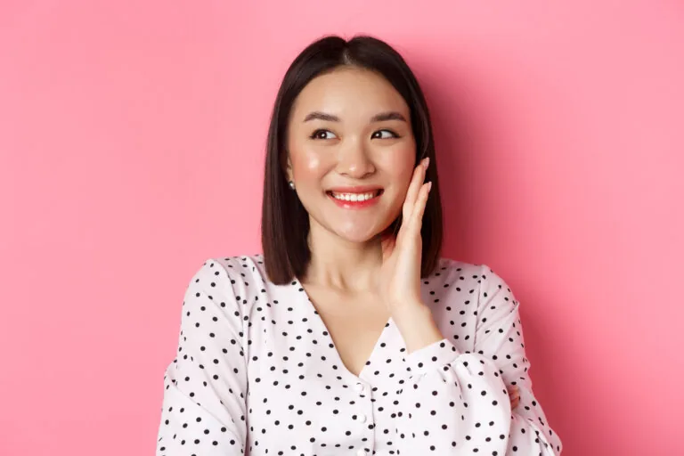 A person with a slight flush across the cheeks.