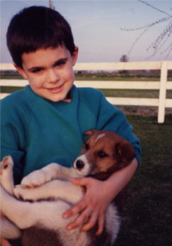 A young Dr. Avilla with his first dog, Andrew